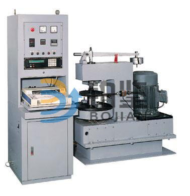 Microcomputer controlled speed friction and wear testing machine.